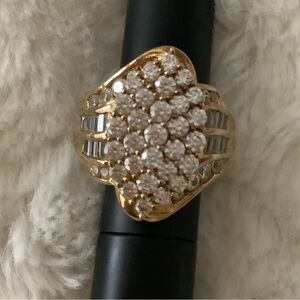 Gold over sterling silver ring w/sparkly cubic zirconia round/baguette shape.